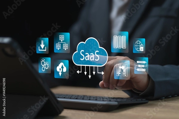 Obraz SaaS, Software as a Service for business, Internet data storage business concept, Businessman use tablets technology software to store data securely,  Modern technology platforms and cloud computing