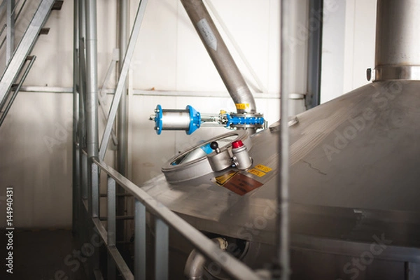 Obraz Beer manufacture line. Equipment for staged production bottling of Finished food products. Metal structures, pipes and tanks at enterprise factory. Special equipment inside within industrial premises