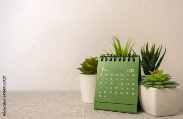 Fototapeta Hello, June. The planning calendar for June 2025 is on the desktop.