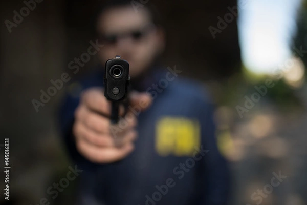 Obraz FBI agent pointing a gun at you