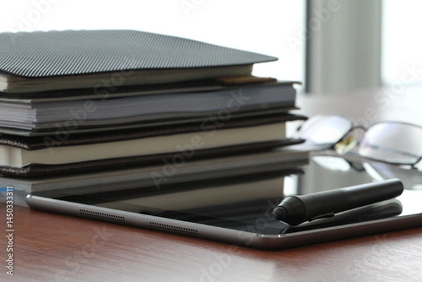 Fototapeta Minimal Office Setup with Books and Tablet