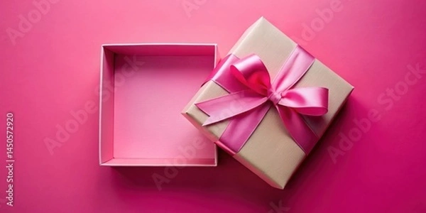 Fototapeta An open gift box with a pink ribbon on a vibrant pink background, revealing an empty interior space, ready for a special surprise.