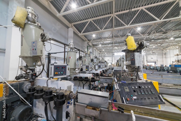 Obraz Extrusion machines processing plastic granules in factory