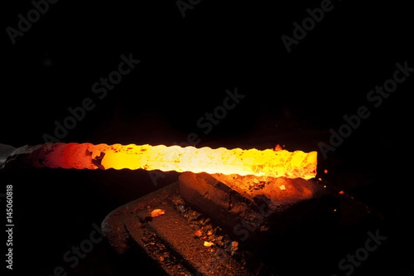 Obraz Blacksmith working on a piece of metal