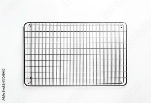Fototapeta A wire cooling rack on a white surface.