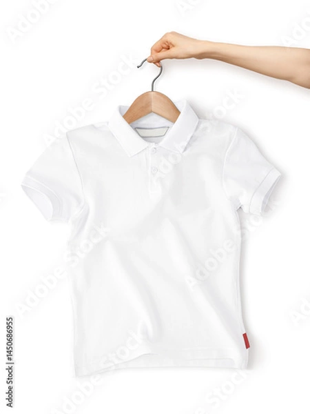 Fototapeta Hand holds Polo Shirt hanging on Hanger crumpled and waves, front view lies isolated on white background. Mockup Blank white Polo Shirt with Wrinkled on studio background with shadow. Top view