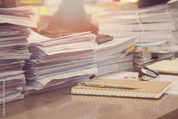 Fototapeta Business Concept, Pile of unfinished documents on office desk, Stack of business paper, Vintage Effect