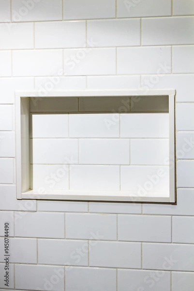 Fototapeta Empty Built-In Tile Shelf Recessed in a Wall of White Subway Tiles