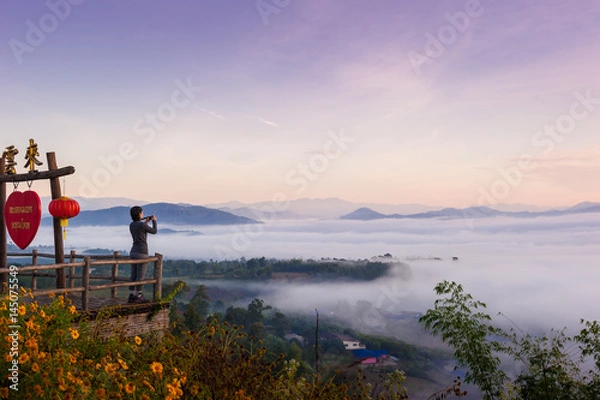 Obraz Tourist with Sunrise and sea of clouds over Pai District Mae Hong Son, THAILAND. View from Yun Lai Viewpoint is located about 5 km to the West of Pai town centre above the Chinese Village.