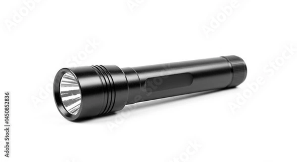 Fototapeta A black flashlight lying horizontally on a white surface in a studio lighting environment setup