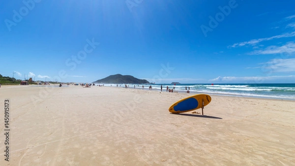 Obraz prancha de surf e  a praia do Santinho Ingleses Florianopolis SC Brasil