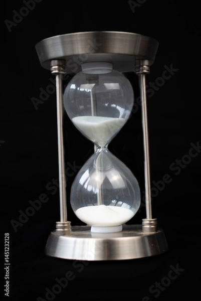 Fototapeta hourglass on black background