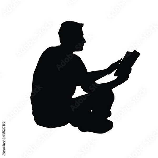 Fototapeta Silhouette of a man reading book