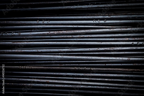 Fototapeta close up steel bar or steel reinforcement bar in the construction site, steel rods bars can use for reinforce concrete. construction background and texture.