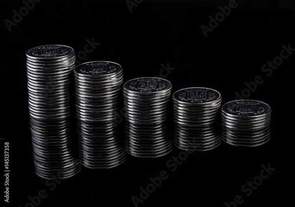 Obraz Mirror coins reflection on black background