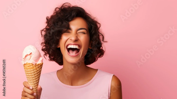 Obraz Young woman enjoying with ice cream cone, happy and joyful, Pink background.