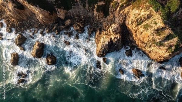 Fototapeta Powerful Waves Crashing on Rocky Cliffs by the Ocean Shore