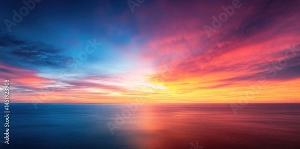 Fototapeta Stunning Sunset over the Ocean: A Breathtaking Display of Colors