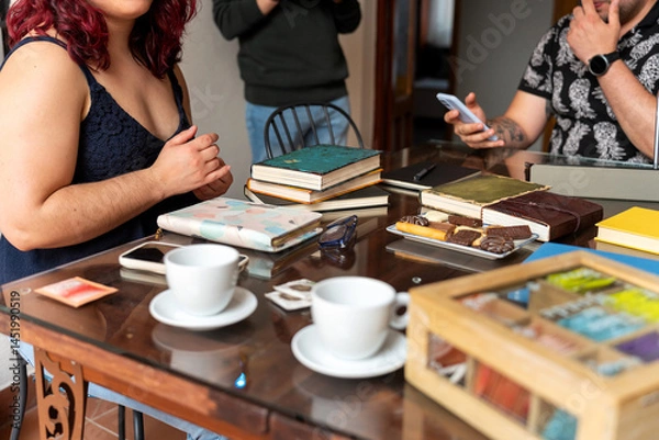 Obraz Writers meeting discussing literature and sharing ideas over coffee and cookies
