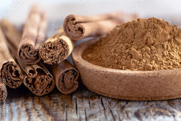 Obraz Cinnamon Sticks and Ground Cinnamon.