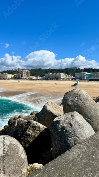 Obraz Seaside Tranquility: Rocks and Waves Under the Clear Sky