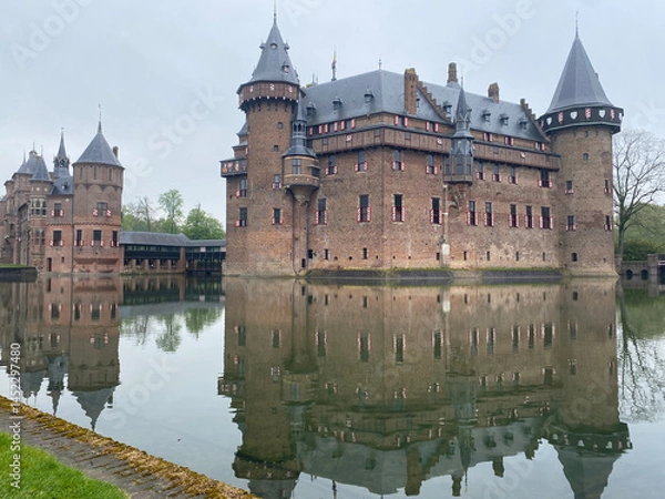 Obraz Exterior view of the majestic De Haar Kastel in the Netherlands, showcasing its impressive towers, moats, and red-brick architecture
