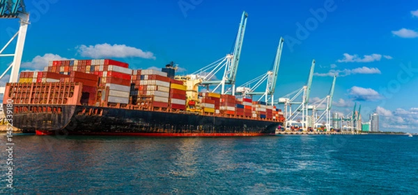 Fototapeta A close up view of a container ship at the South Florida Container Terminal in Miami in springtime