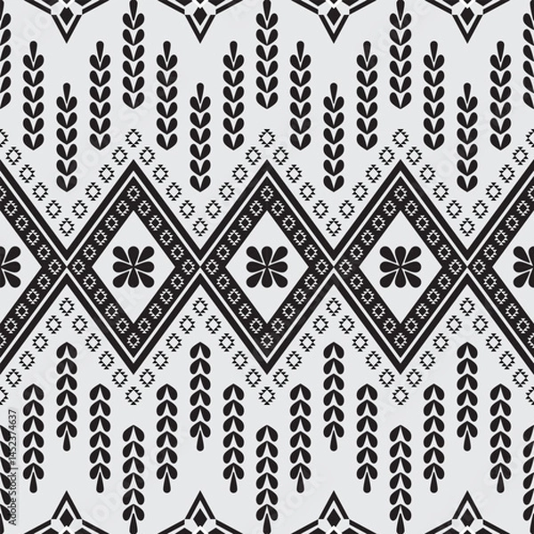 Fototapeta A black-and-white geometric pattern inspired by traditional textile designs. Featuring symmetrical diamond shapes, floral motifs, and vertical repetitive elements.