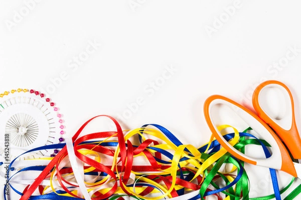 Fototapeta Scissors, pins and color tapes on green background