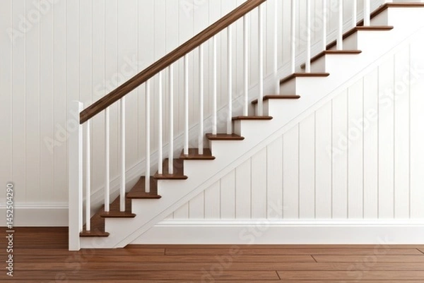 Fototapeta Wooden staircase with white paneling and a wooden railing.  Interior view with hardwood floors
