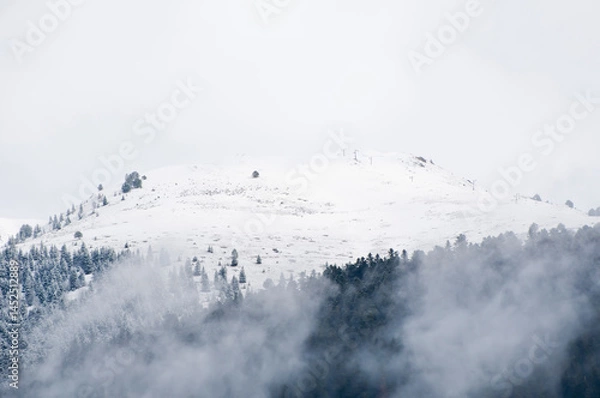 Obraz Snowy slope surrounded by fog