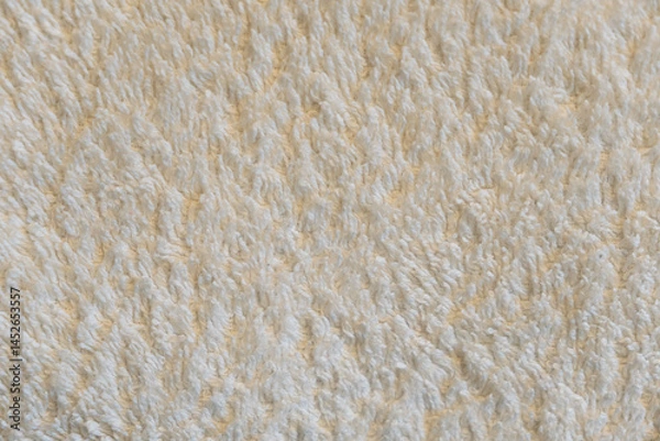 Fototapeta A close up of a white towel with a fuzzy texture