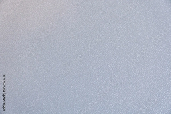 Fototapeta A grey background with a few white dots