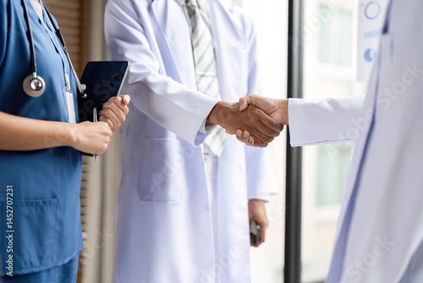 Obraz Healthcare Professionals Shaking Hands to Foster Collaboration