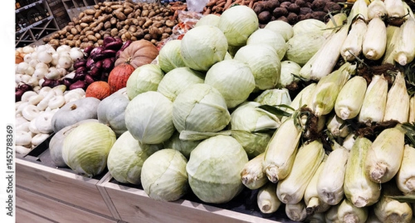 Obraz Showcase with fresh vegetables in the store. Seasonal fruits and vegetables