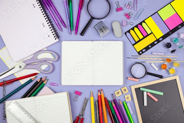 Obraz A Vibrant Arrangement of Colorful School Supplies Displayed on a Study Table for Learning