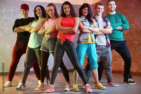Fototapeta Group of young hip-hop dancers in studio