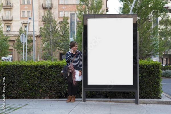 Obraz Blank billboard and woman with mobile