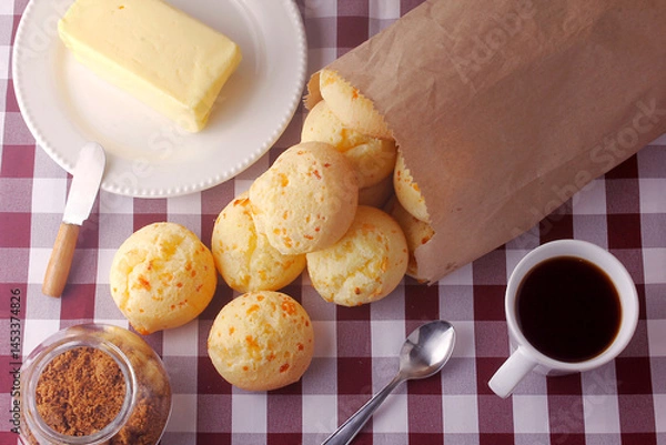 Fototapeta homemade cheese bread, traditional Brazilian snack, on the breakfast table in a rustic farm kitchen