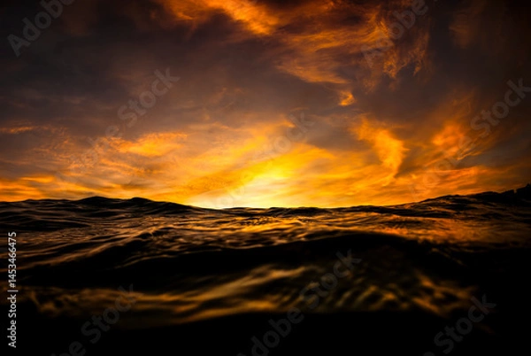 Fototapeta Golden sunset over the ocean as seen from the surface off Sydney, Australia.