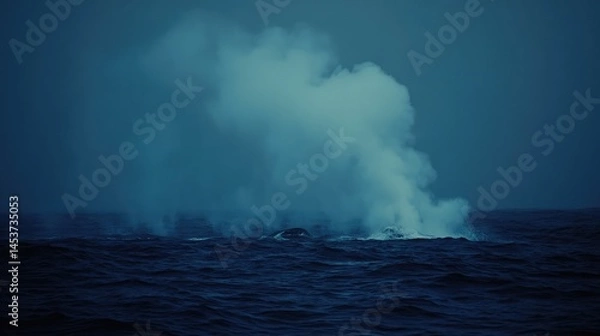 Fototapeta Blowholes release powerful mists into the air as whales cross the sea