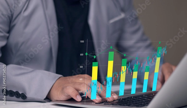Fototapeta Business cost and quality analysis for performance optimization. businessman typing on keyboard with a digital overlay of graphs, showcasing trends, insights, and efficiency.