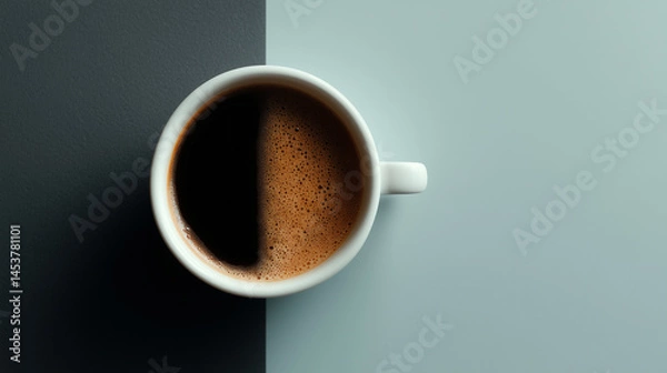 Fototapeta Dark coffee in a white cup displayed on a contrasting background