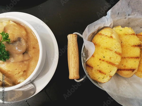 Obraz Slices garlic bread and Mashed potatoes in top view.