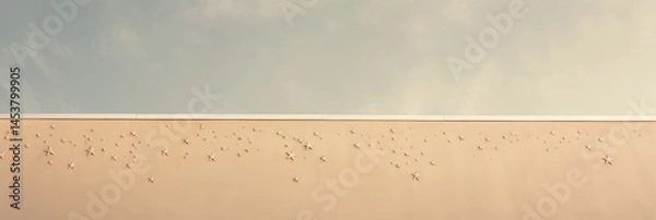 Obraz Minimalist wall adorned with small decorative stars under a soft, cloudy sky, evoking a serene blend of simplicity and artistic expression