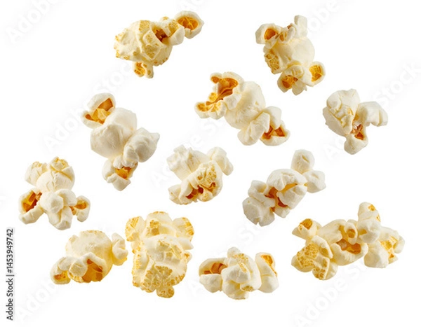 Fototapeta floating popcorn kernels suspended in air, white fluffy snack food isolated on background
