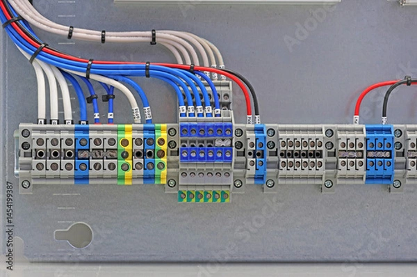Fototapeta Electrical terminals with connected insulated copper wires with metal lugs. Marking with a thermal printer. 