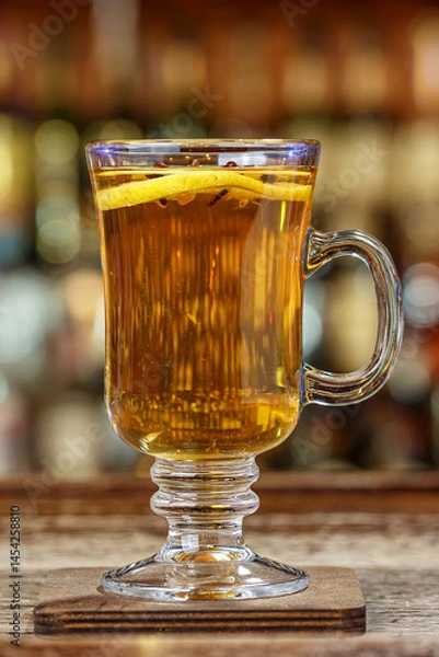 Obraz hot drink with spices, garnished with orange