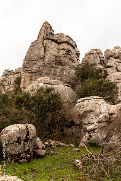 Obraz Horizontal photo of karst rock formations at cloudy spring day. Impressive rock formations in El Torcal de Antequera, sculpted naturally over millennia in a stunning Mediterranean setting.