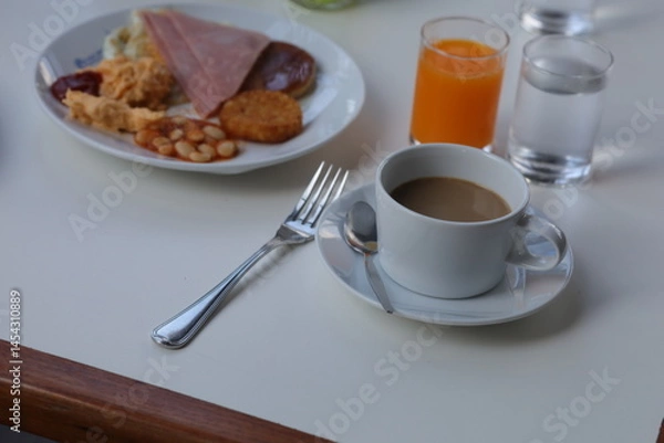 Fototapeta Classic breakfast set with ham, egg, bean, toast and juice.